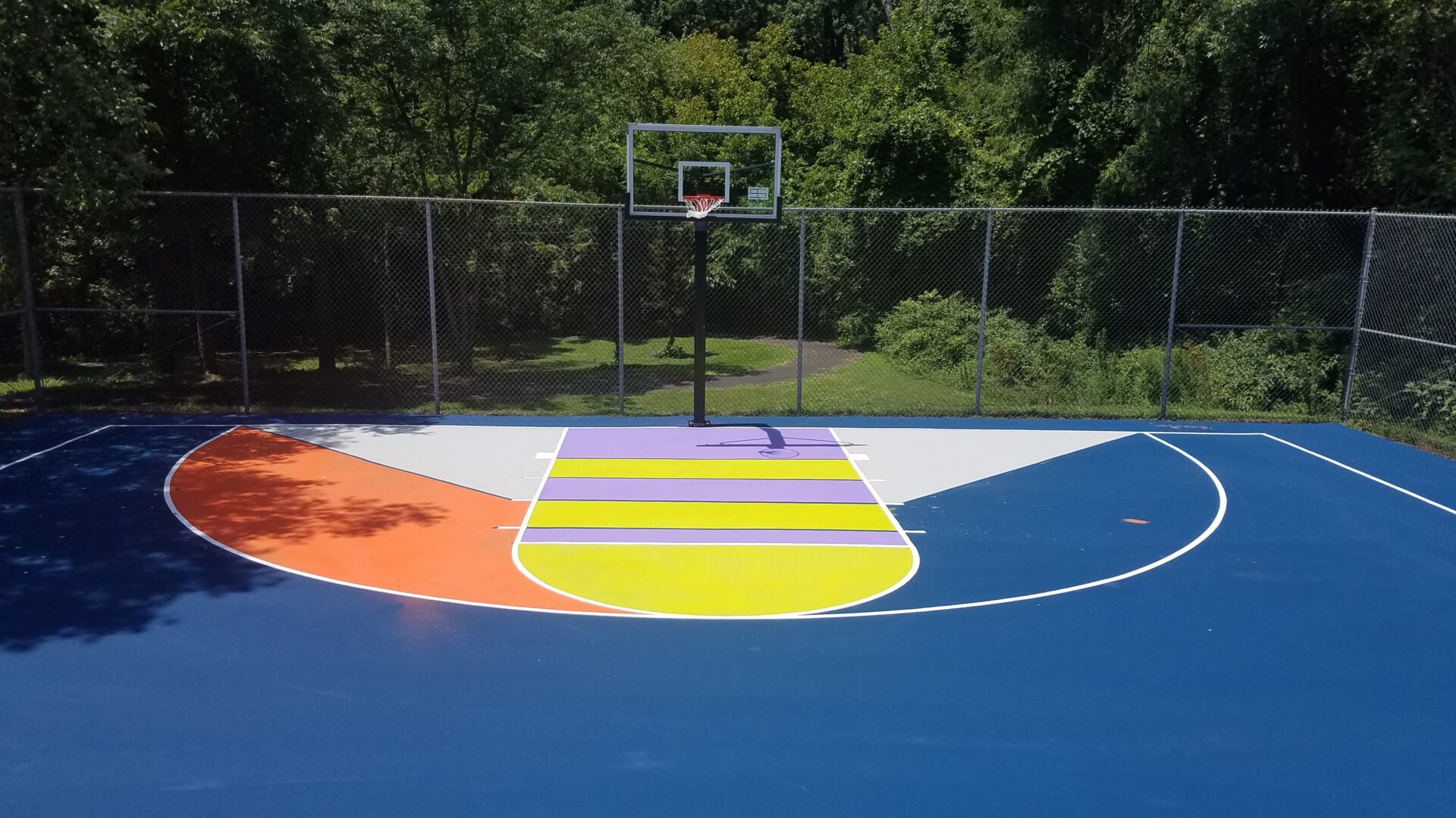 A basketball court with a basket ball hoop.