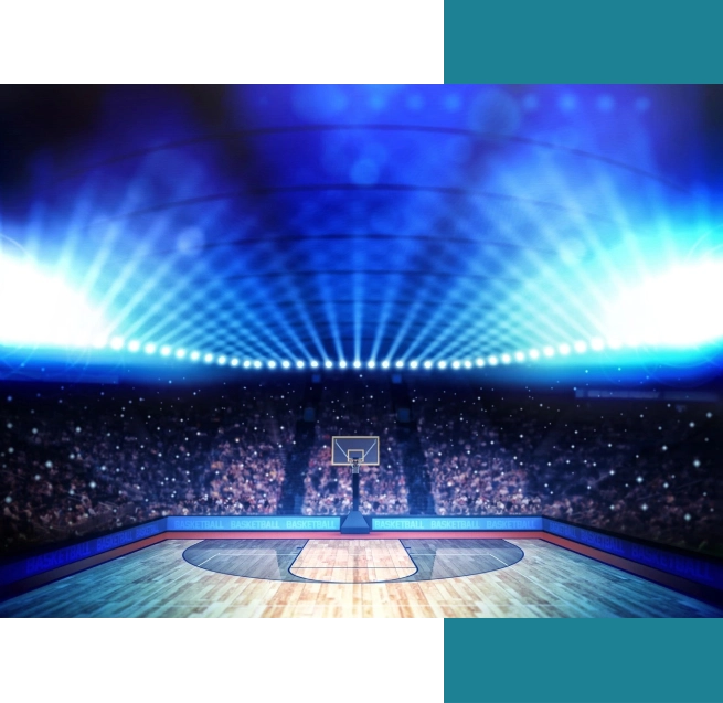 A basketball court with lights on the side of it