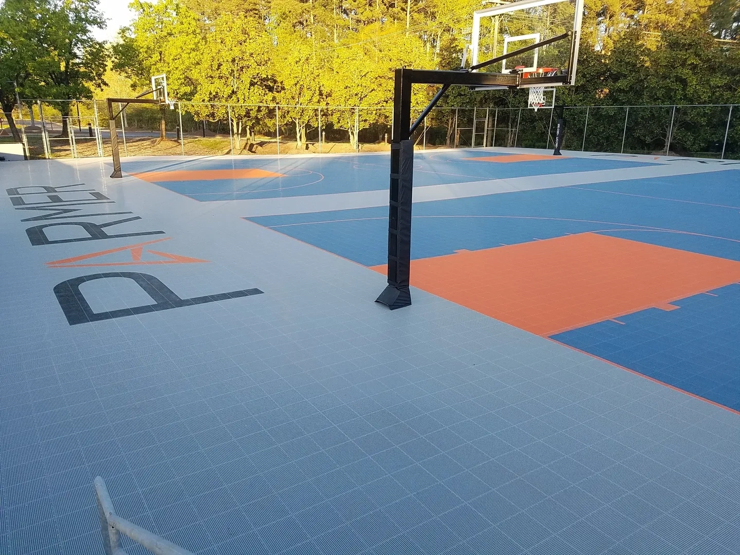 A basketball court with a basket ball hoop.