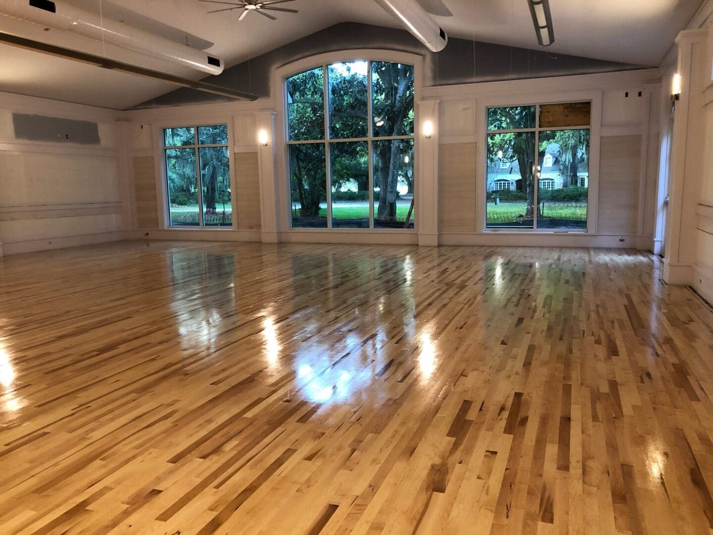 an empty hall with wooden floor